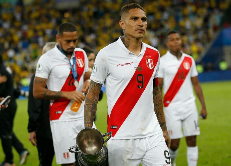 Peru's players reflect on their loss. AP Photo