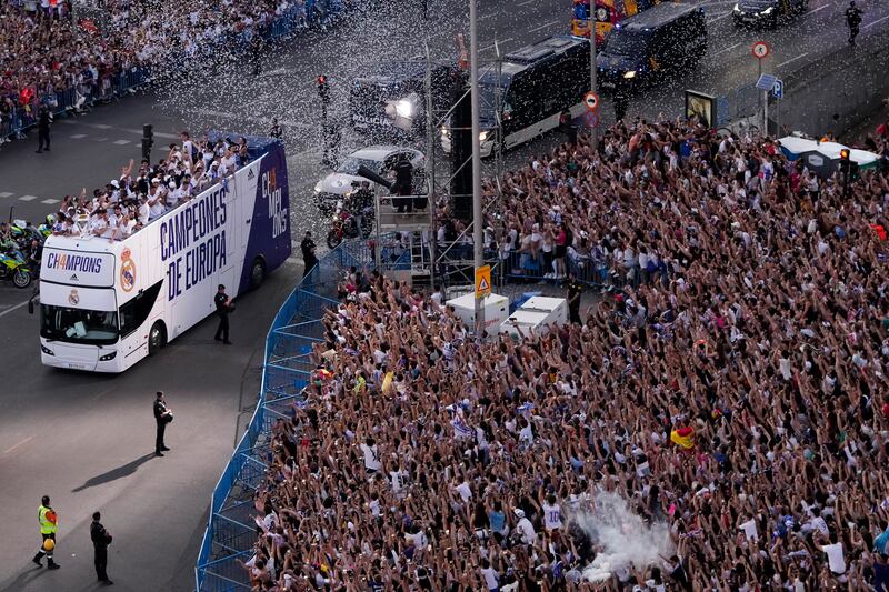 Real Madrid players on an open-top bus during the trophy parade in front of the City Hall in Madrid. AP