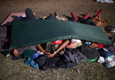 Migrants, part of a caravan of thousands from Central America trying to reach the United States, sleep on the ground at a shelter in Tijuana, Mexico, November 18, 2018. REUTERS/Hannah McKay