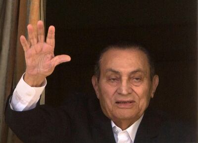 FILE - In this April 25, 2016 file photo, ousted Egyptian President Hosni Mubarak waves to his supporters from his room at the Maadi Military Hospital, where he is hospitalized, in Cairo, Egypt.  Egypt's former autocratic ruler Hosni Mubarak, who was forced to step down following 2011 mass protests, has undergone a surgery, his eldest son tweeted on Friday, Jan. 24, 2020. Alaa Mubarak tweeted that his 91-year-old father was operated on Thursday and that his condition was â€œstableâ€.  He did not provide any further details about the surgery. (AP Photo/Amr Nabil, File)