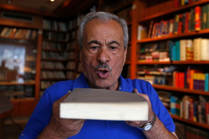 Muhammad Salem Al Nouri, 71, blows dust off a book at the Dar Al Maarifa library in Damascus, which was forced to close in 2000 because of poor sales and growing costs. All photos: AFP