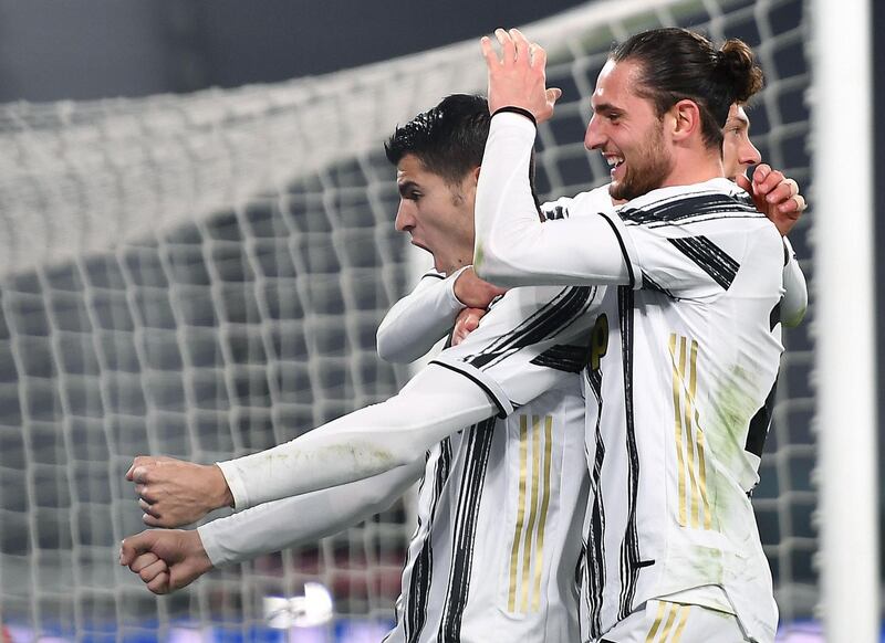 Juventus' Alvaro Morata celebrates with teammate Adrien Rabiot. EPA