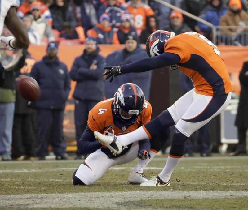 Denver's Matt Prater, right, kicked a NFL record 64-yard field goal this season. Jack Dempsey / AP Photo