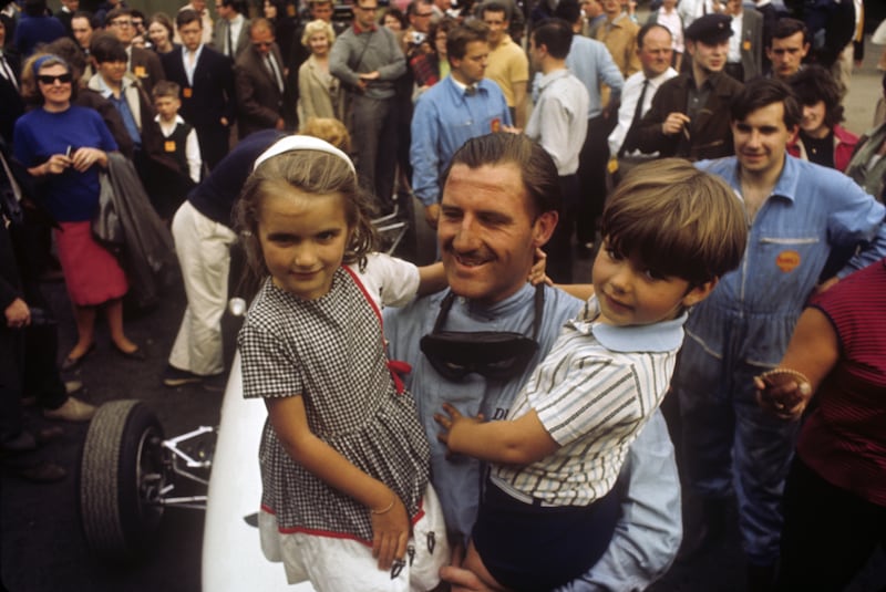 Graham Hill (1929 – 1975) British racing driver and team owner, after  winning the 1965 Monaco Grand Prix with his children Brigitte  and Damon, May 30, 1965. Getty Images