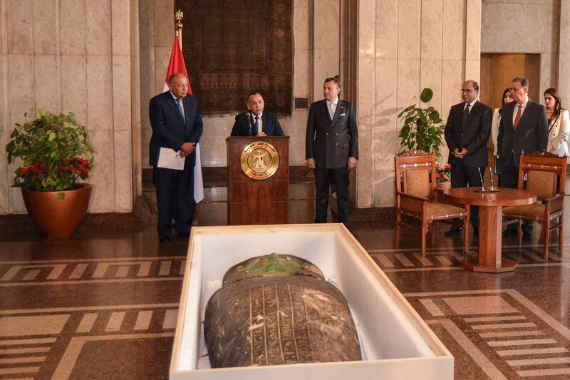 Egypt's Foreign Minister Sameh Shoukry (L) and Tourism and Antiquities Minister Ahmed Issa (C-R) look on as the head of the Supreme Council of Antiquities Mostafa Waziri (C) gives a statement during a handover ceremony for an ancient Egyptian wooden sarcophagus that was looted and smuggled years prior and was formerly displayed at Houston Museum of Natural Sciences, at the foreign ministry headquarters in the capital Cairo. AFP