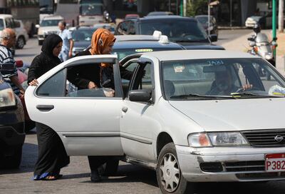 Women get into a taxi in Beirut, Lebanon, in July 2020. Reuters