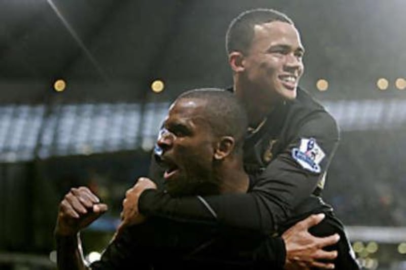 Darren Bent celebrates scoring the first of his two goals with Jermaine Jenas in Totteham's 2-1 win against Manchester City.