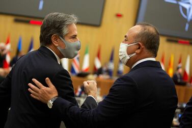 US Secretary of State Antony Blinken, left, greets Turkish Foreign Minister Mevlut Cavusoglu before a Nato foreign ministers' meeting in Brussels. AFP 