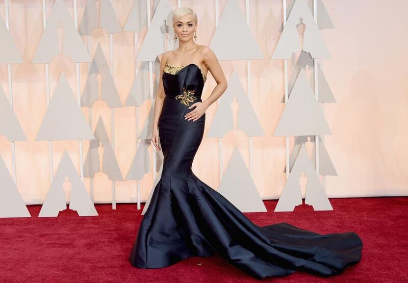 Rita Ora’s navy, super-long fishtail dress failed on many levels; from the highly contoured face and platinum blonde hair to the tight on the hips, loose on the torso fit of the dress. Jason Merritt / Getty Images / AFP