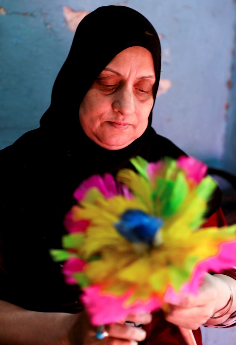Nawal Abdel Muttalib, 54, works in Egypt's informal feather industry to make ends meet. All Photos: Reuters