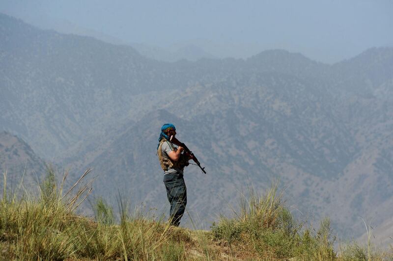 Afghan security forces keep watch near the site of U.S. airstrike on a civilian vehicle in Haska Mina district Nangarhar province on August 12, 2017.
The United States on Saturday vehemently denied claims by Afghan officials that it had killed several civilians in an air strike in volatile eastern Afghanistan. / AFP PHOTO / NOORULLAH SHIRZADA