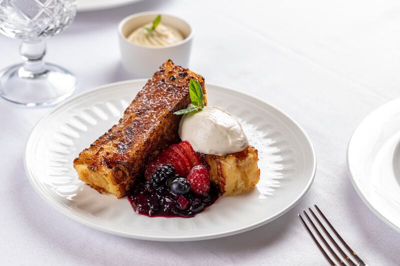 French toast with vanilla egg cream, berries and Chantilly cream.