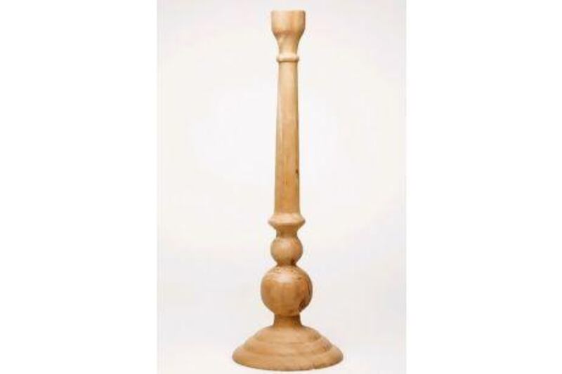 Natural wood candlestick. Tina Chang / The National