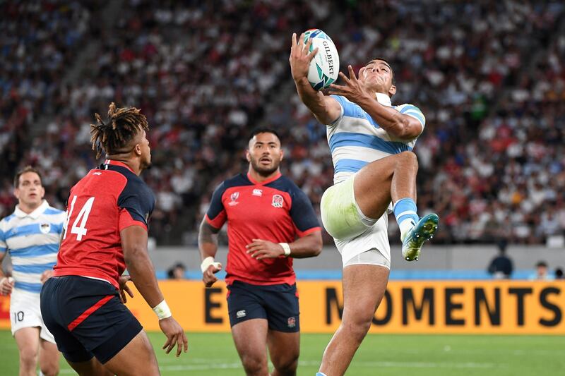 Argentina's wing Santiago Carreras intercepts the ball during the Pool C against England. AFP