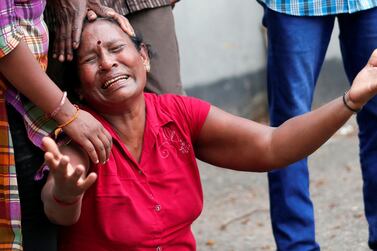 A relative of a victim of the explosion at St. Anthony's Shrine, Kochchikade church, reacts at the police mortuary in Colombo, Sri Lanka April 21, 2019. REUTERS/Dinuka Liyanawatte