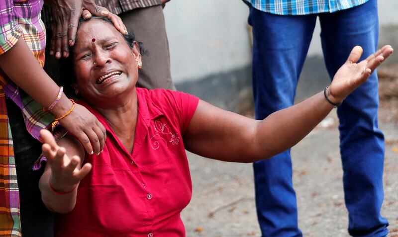 A relative of a victim of the explosion at St. Anthony's Shrine, Kochchikade church, reacts at the police mortuary in Colombo, Sri Lanka April 21, 2019. REUTERS/Dinuka Liyanawatte