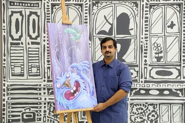 Dubai, United Arab Emirates - August 9, 2018: Melvin Mathew, owner and artist with his work Monster. A sneak preview of the re opening of the Cartoon Gallery after changing location. They also have an exhibition on from the 16th-22nd of Aug. Thursday, August 9th, 2018 in Al Quoz, Dubai. Chris Whiteoak / The National
