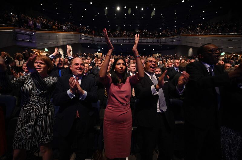 Ms Braverman applauds as Prime Minister Liz Truss delivers her keynote address on the final day of the Conservative Party Conference in Birmingham in 2022. AFP