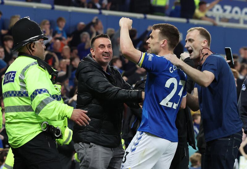 Everton's Seamus Coleman celebrates with Everton fans as they avoid relegation. Reuters