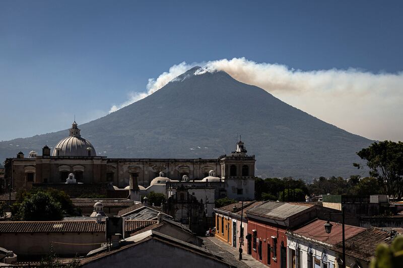 Smoke rises as a forest fire rages at the summit of Agua Volcano near Antigua, Guatemala. EPA