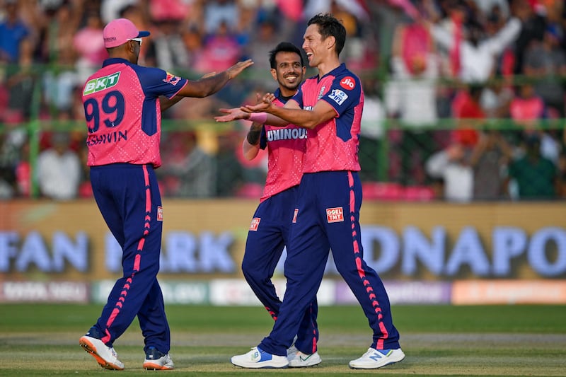 Rajasthan Royals' Trent Boult celebrates with teammates after taking the wicket of Lucknow Super Giants' Quinton de Kock. AFP