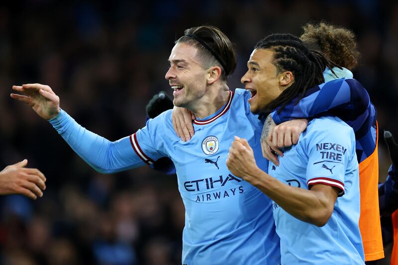 Nathan Ake celebrates after scoring with Manchester City teammate Jack Grealish. Getty