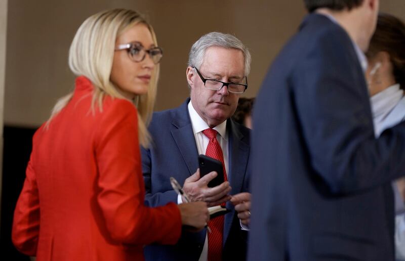 New White House press secretary Kayleigh McEnany consults White House chief of staff Mark Meadows and other Trump administration aides in the wings as US President Donald Trump participates in a live Fox News Channel virtual town hall called 'America Together: Returning to Work'. Reuters