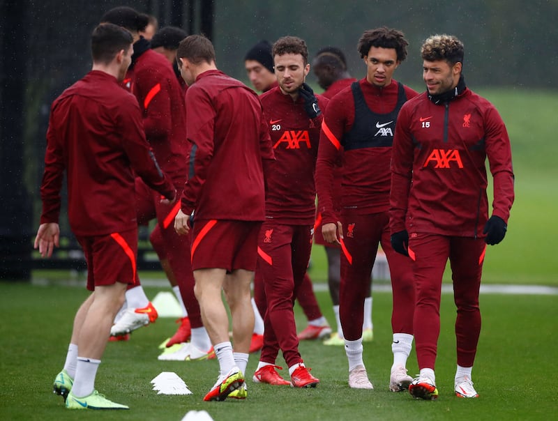 Liverpool's Alex Oxlade-Chamberlain, Trent Alexander-Arnold and Diogo Jota. Reuters