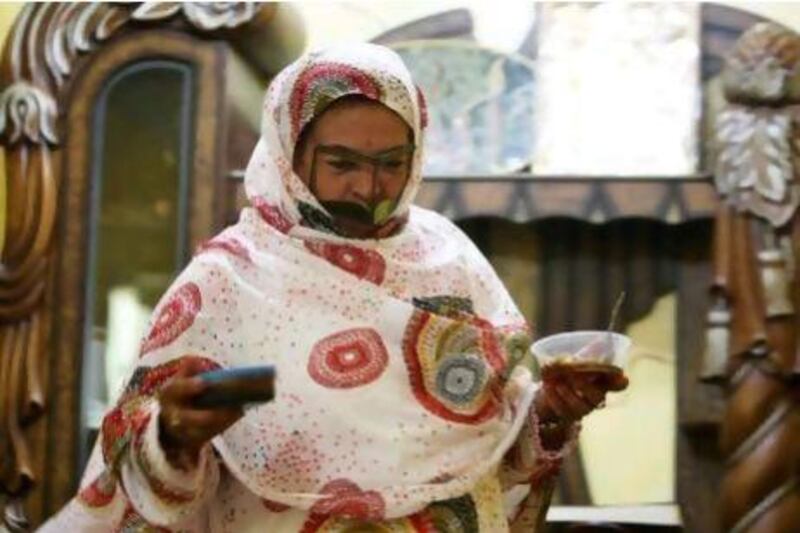 Sheikha Ali Saif Al Qaydi showing the raw honey and filtered honey at her home in Al Munai village in Ras Al Khaimah. ( Pawan Singh / The National )