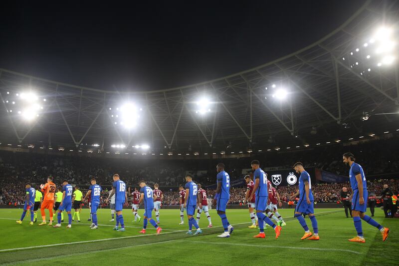 Players walk on to the pitch wearing black arm bands at the Europa Conference League match between West Ham United and Romanian opponents FCSB at London Stadium. Getty