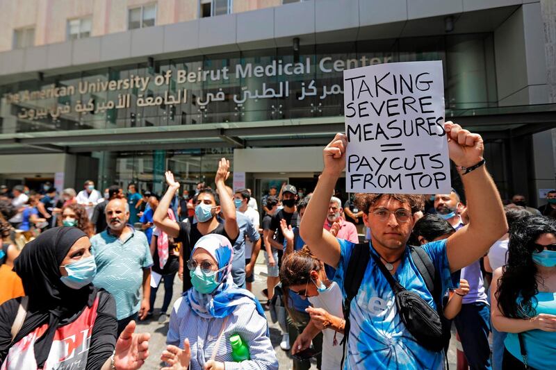 Lebanese activists demonstrate along with former employees of the American University Medical Centre in Beirut after they were dismissed from their jobs last week. AFP