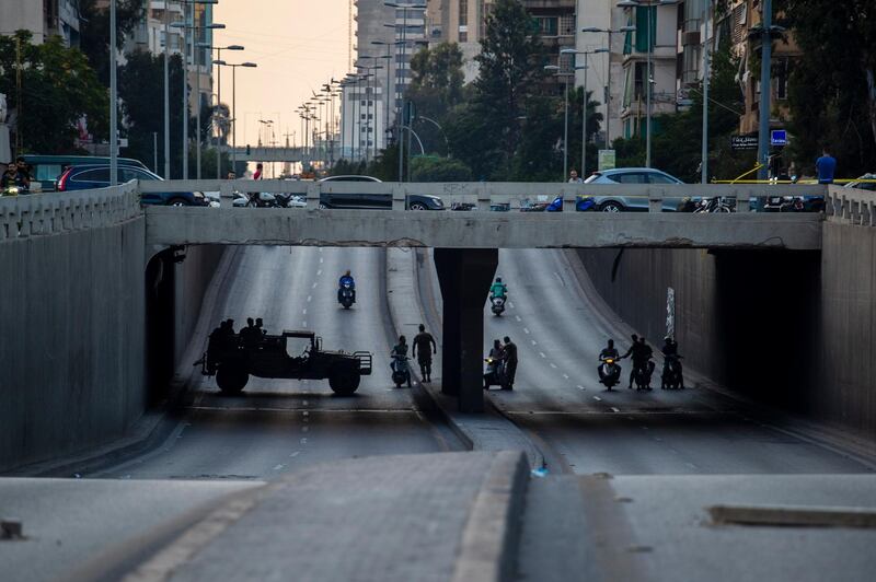 Lebanese army soldiers deploy on a street where anti-government protesters block a main road with garbage containers, during ongoing protests against the Lebanese government, in Beirut, Lebanon. AP Photo