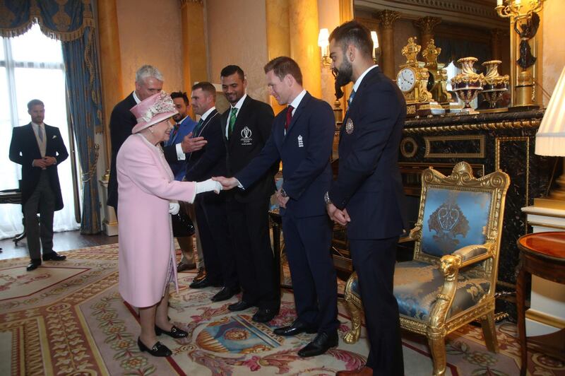 The Queen chats to England's captain Eoin Morgan. AFP