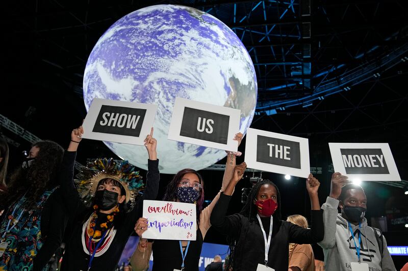 Climate activists engage in a 'Show US The Money' protest at the summit venue. AP Photo