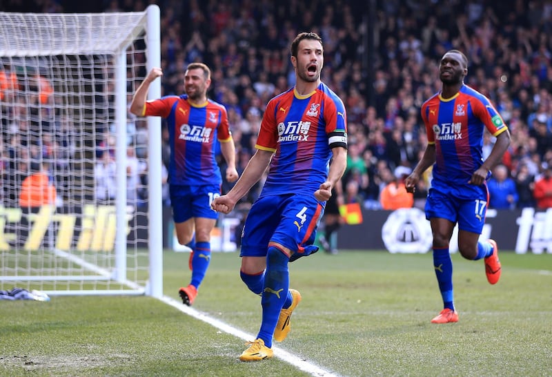 Luka Milivojevic of Crystal Palace celebrates with teammates after scoring his team's first goal. Getty Images