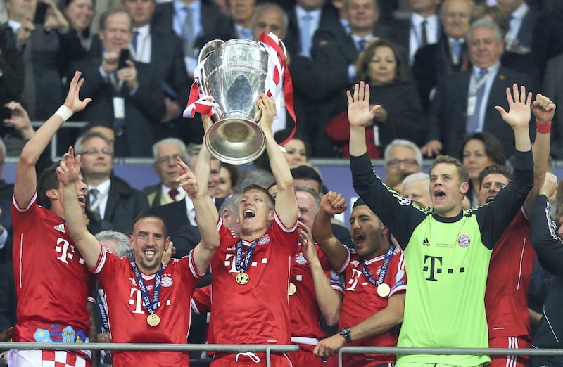 LONDON, ENGLAND - MAY 25:  Bastian Schweinsteiger of Bayern Muenchen lifts the trophy in celebration alongside team mates after victory in the UEFA Champions League final match between Borussia Dortmund and FC Bayern Muenchen at Wembley Stadium on May 25, 2013 in London, United Kingdom.  (Photo by Alex Grimm/Getty Images)