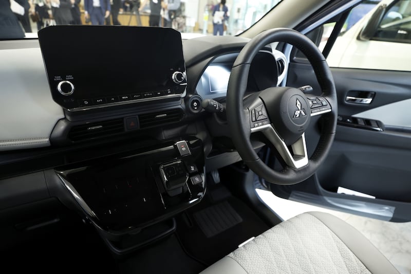The interior of a Mitsubishi Motors Corp.  eK X electric vehicle (EV) displayed following an off-line ceremony at the company's Mizushima plant in Kurashiki, Okayama Prefecture, Japan, on Friday, May 20, 2022.  Kei is short for keijidosha, meaning light automobile, and they account for a third of all sales in the country.  Nissan and Mitsubishi released electric kei models to market on May 20. Photographer: Kiyoshi Ota / Bloomberg