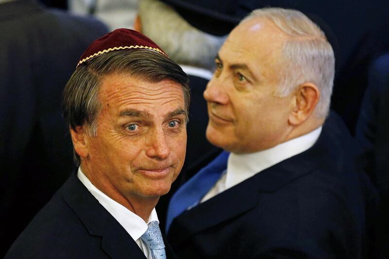 epa07252060 A handout photo made available by AGenciua Brasil shows Brazilian President-elect Jair Bolsonaro (L) and Israeli Prime Minister Benjamin Netanyahu (R) participates in an act at a synagogue in Rio de Janeiro, Brazil, 28 December 2018. Brazil President Bolsonaro and Israeli Prime Minister Netanyahu agreed to start a strategic alliance between both countries to cooperate in areas such as technology, defense, agriculture, security and water.  EPA/Agencia Brasil/Fernando Frazao HANDOUT EDITORIAL USE ONLY/NO SALES HANDOUT EDITORIAL USE ONLY/NO SALES