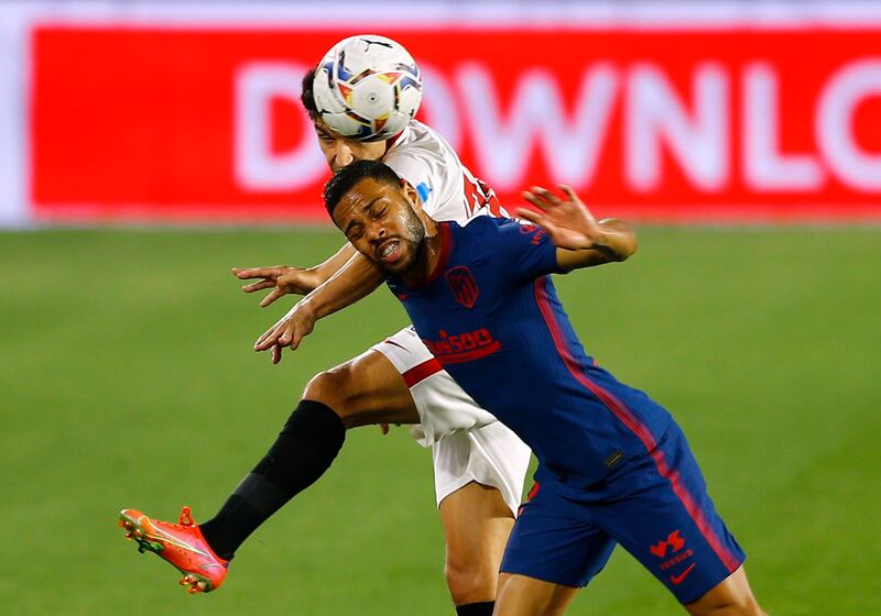 Atletico Madrid's Renan Lodi in action with Sevilla's Jesus Navas. Reuters
