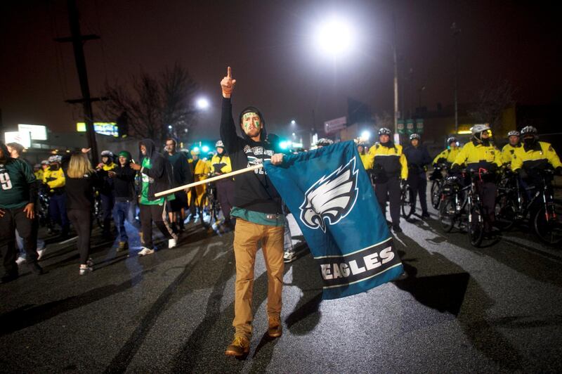 Tom Roush waves a flag while celebrating the Philadelphia Eagles Superbowl LII victory over the New England Patriots in Philadelphia, Pennsylvania U.S. February 5, 2018.  REUTERS/Mark Makela