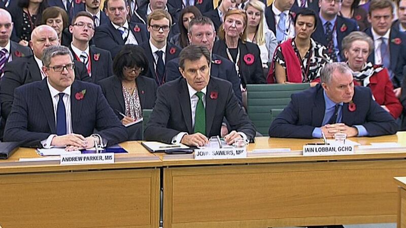 M15 chief Andrew Parker,  John Sawers, the head of M16, and Iain Lobban GCHQ director Iain Lobban attend an Intelligence and Security Committee hearing in the British parliament. UK Parliament via Reuters
