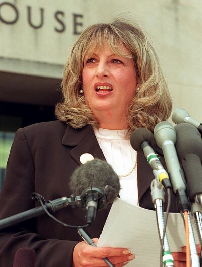 Linda Tripp talks to reporters outside of the Federal Courthouse on July 29, 1998 in Washington, DC, following her eighth day of testimony before the grand jury investigating the Monica Lewinsky affair. AFP 
