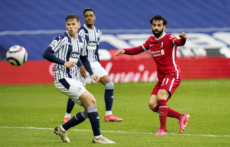 WEST BROMWICH, ENGLAND - MAY 16: Mohamed Salah of Liverpool scores their team's first goal during the Premier League match between West Bromwich Albion and Liverpool at The Hawthorns on May 16, 2021 in West Bromwich, England. Sporting stadiums around the UK remain under strict restrictions due to the Coronavirus Pandemic as Government social distancing laws prohibit fans inside venues resulting in games being played behind closed doors. (Photo by Tim Keeton - Pool/Getty Images)