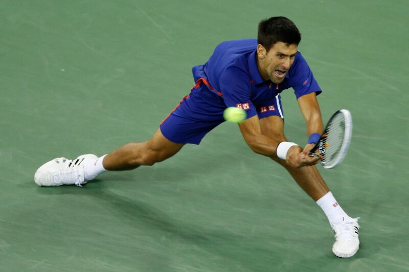 Serbia's Novak Djokovic returns a shot to Britain's Andy Murray during the championship match at the 2012 US Open tennis tournament, Monday, Sept. 10, 2012, in New York. (AP Photo/Julio Cortez) *** Local Caption ***  US Open Tennis.JPEG-0c47c.jpg