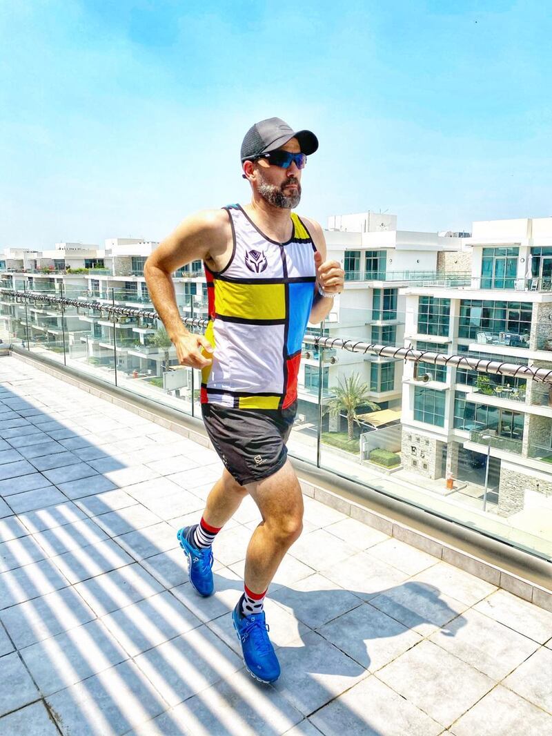 Collin practises on his balcony ahead of Saturday morning's marathon. He'll have to complete 2,200 full lengths of the Meydan apartment to hit 42.2km. Courtesy: Collin Allin