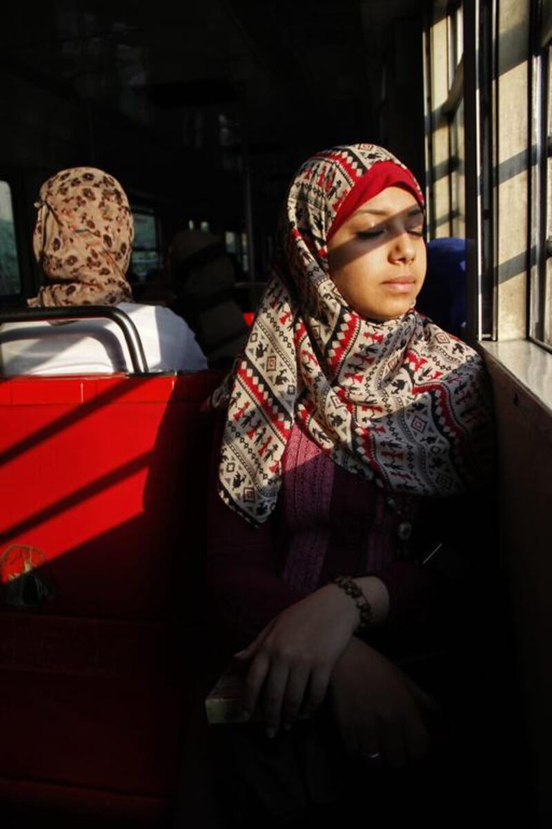 Leila Abdel Basset, 24, rides the metro to work in an all-female car, in Cairo, Egypt.