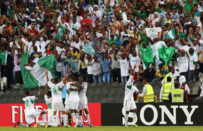 Nigerian players celebrate after winning the FIFA U-17 World Cup 2013 at Mohammed bin Zayed Stadium, on November 8, 2013 in Abu Dhabi, UAE. Nigeria won the final against Mexico 3-0.  AFP PHOTO  MARWAN NAAMANI