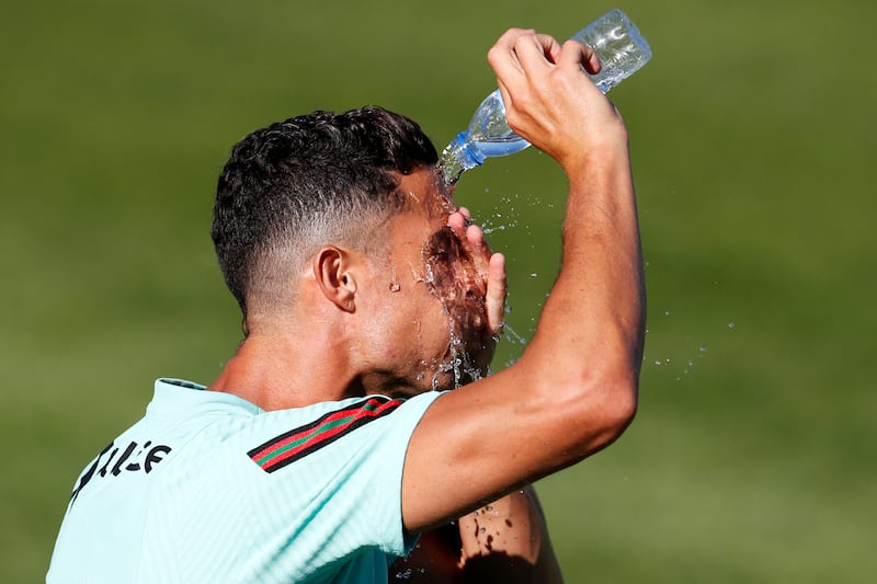 Portugal's Cristiano Ronaldo cools off at training. AP