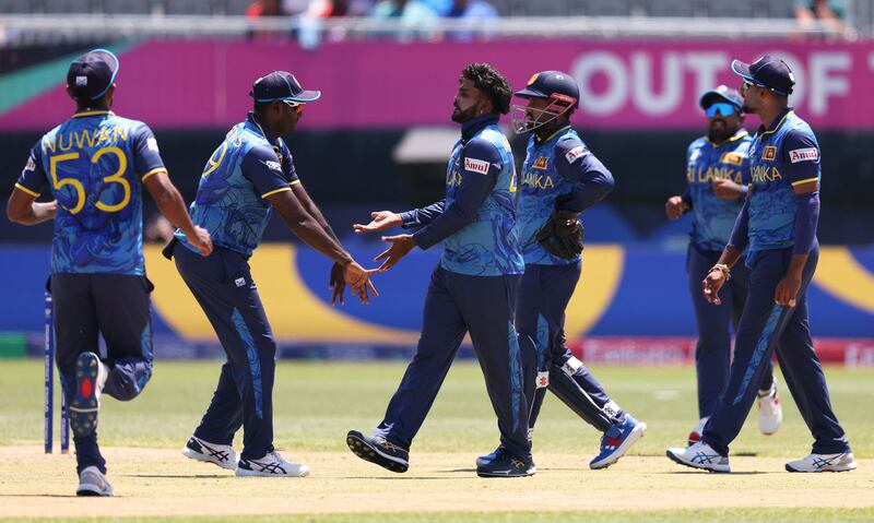 Sri Lanka players celebrate the wicket of South Africa's Quinton de Kock. AFP