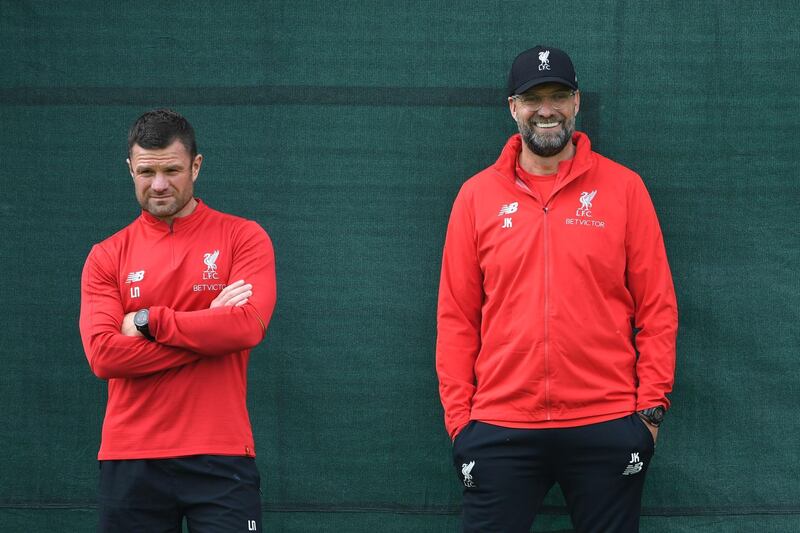 Liverpool manager Jurgen Klopp, right, looks on during training at Melwood ahead of Liverpool's Uefa Champions League semi-final, first leg against Barcelona. AFP